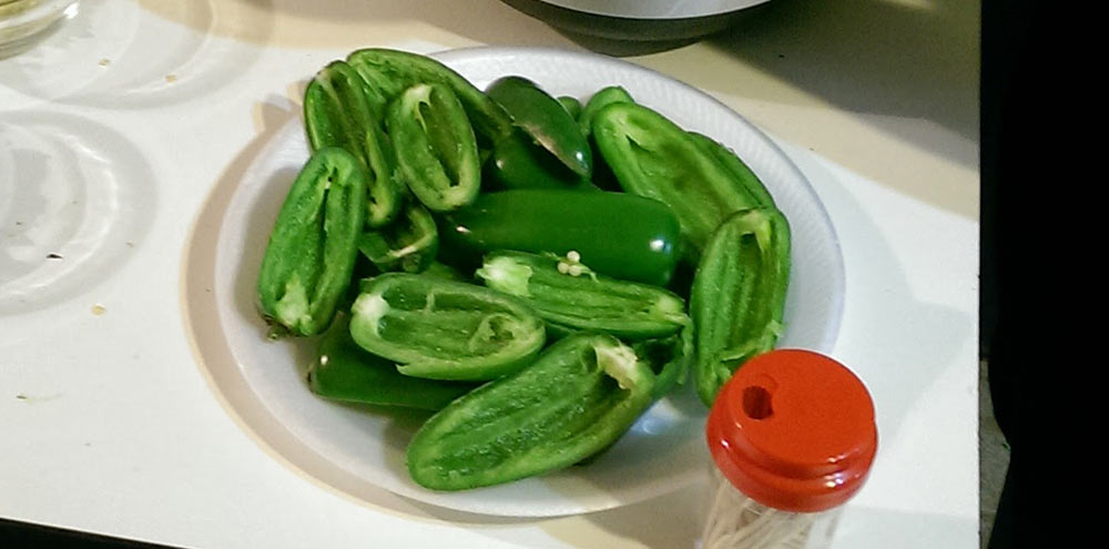 Halved jalapenos in a tray